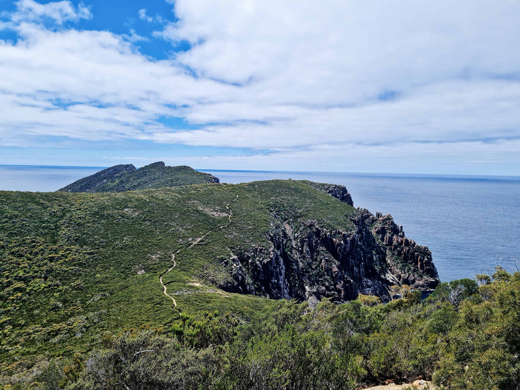 Descending the cliffs of Cape Huay, Tasman National Park